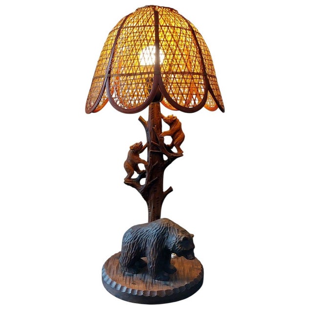 Bring the charm of the wilderness into your home with this handcrafted rustic table lamp. Featuring a detailed wooden base...