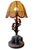 Bring the charm of the wilderness into your home with this handcrafted rustic table lamp. Featuring a detailed wooden base...