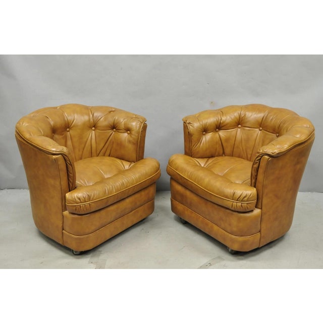 Vintage Mid Century Modern Chesterfield Style Brown Button Tufted Leather Barrel Back Club Chairs on Rolling Casters by...
