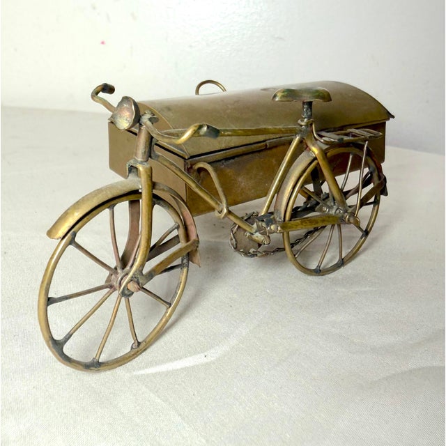 Up for sale is an exquisite handmade antique brass bicycle with moving parts and a side car trinket box. The intricate...