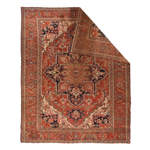 In the better "Serapi" grade of weave, this NW Persian rustic carpet shows an ivory field, wire thin at the sides, but...