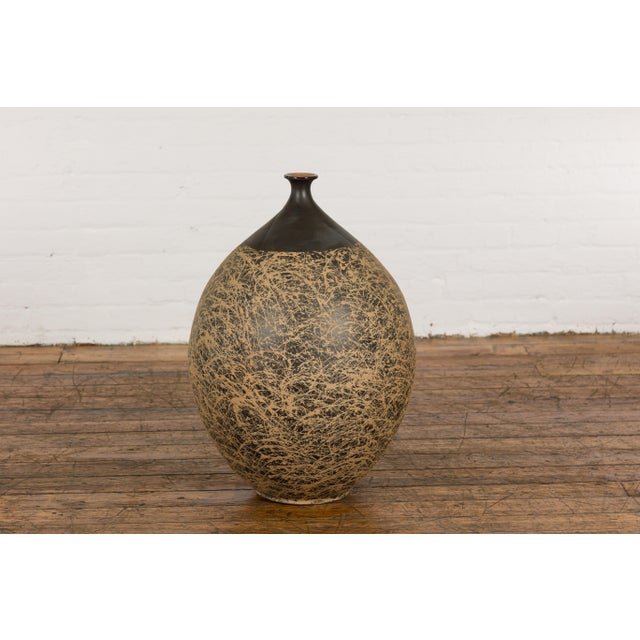 A large contemporary Prem Collection artisan hand crafted ceramic vase or object with narrow mouth, black ground,...