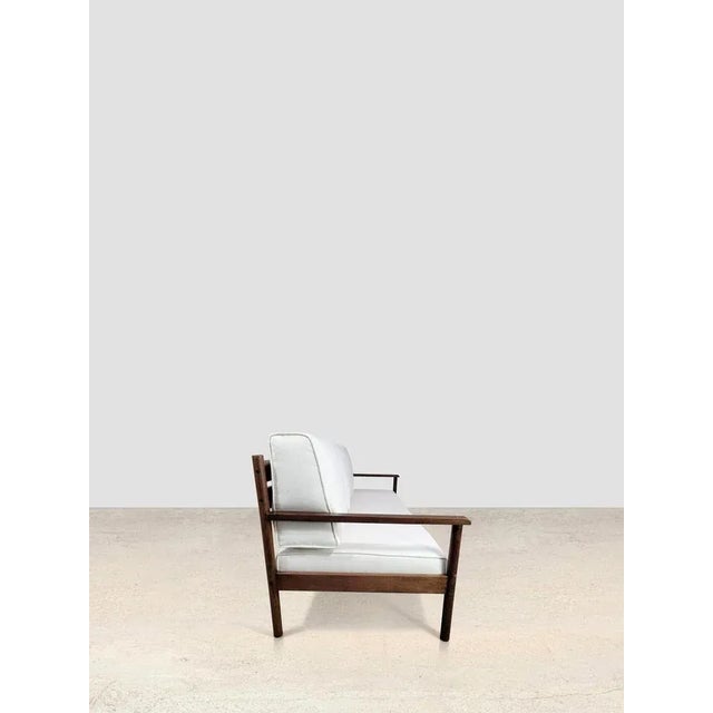 By Michel Arnoult, 1960’s Beautiful and comfortable sofa in fine wood by Michel Arnout with new upholstery. 197 x 79 x 83 cm