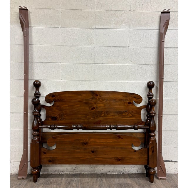 This is a beautiful vintage solid pine full sized cannonball poster bed featuring oversized turned posts, ball finials,...