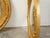 A pair of English giltwood convex mirrors from the mid 20th century, with carved acorns and foliage motifs. Created in...