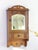 Antique small wooden cabinet with an arched shaped beveled mirror in the front door. The medicine cabinet is adorned by...