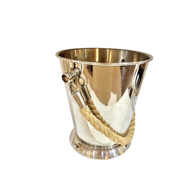 Fun vintage stainless champagne ice bucket with a chunky rope handle. Perfect for large bottles and lots of ice. No marks....