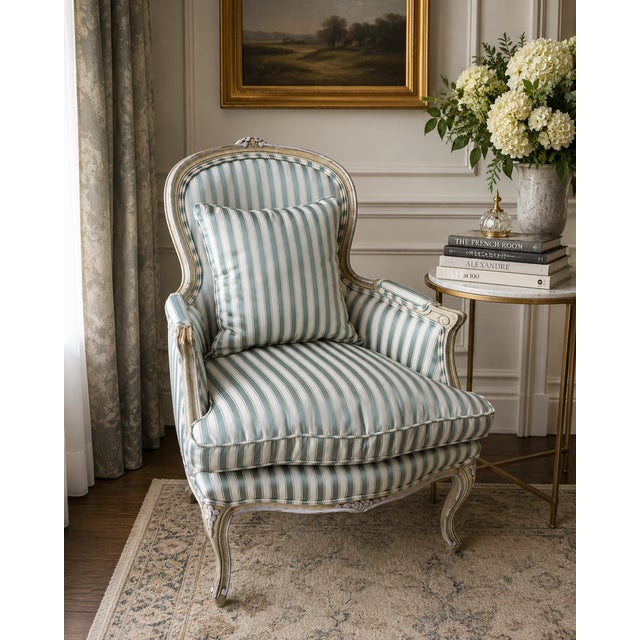 Bring refined Parisian elegance to your interior with this stunning French Louis XV style bergère armchair. The classic...