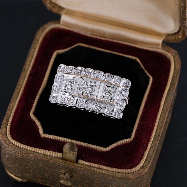 Vintage Art Deco diamond ring featuring bright round brilliant cut and single cut natural diamonds in 14k white gold....