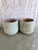 Pair of oversized weathered terra cotta planters, circa 1970-1990, with exceptional pitted limestone finish. Cylindrical...