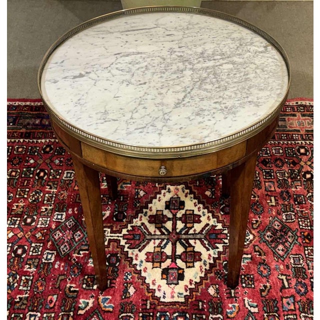 Louis XVI Style Bouillotte Table in Mahogany with White Marble Top, 1930s, in Good conditions. Designed 1920 to 1949