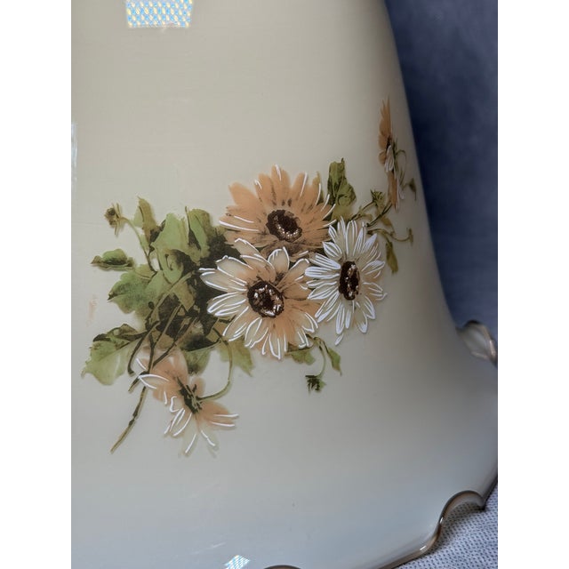 1970s pendant lamp featuring a cream-toned glass shade with floral decoration and a softly scalloped rim. Combined with...