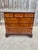 An exceptional Georgian burled walnut chest of drawers from the Milling Road Collection by Baker Furniture. The chest...