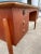 In the manner of Arne Vodder, a Mid Century Modern Scandinavian Executive Desk with Original Protective Glass Top. Ample...