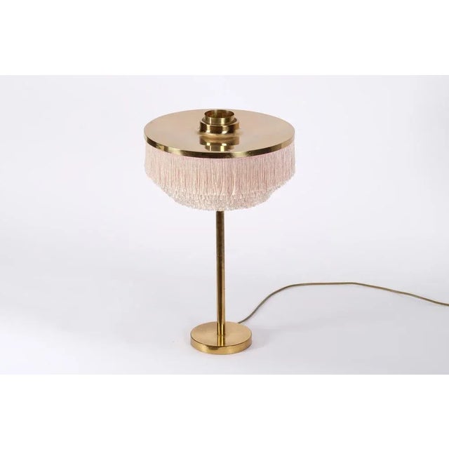 Table lamp model B-138 produced by Hans-Agne Jakobsson in Markaryd, Sweden. New wiring. Very good condition. This piece is...