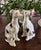 Exquisite pair of vintage porcelain sighthound figurines by the revered luxury home furnishings brand, Maitland-Smith....