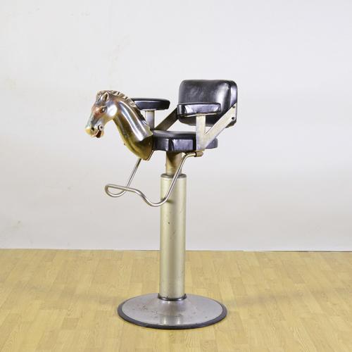 This extraordinary children's barber chair, dating back to the mid-1900s, is a rare and irresistible piece of modern...
