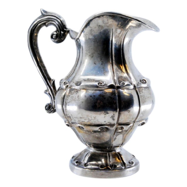 Gummed Silver Milk Jug with Raised Scrolls and Circular Base For Sale