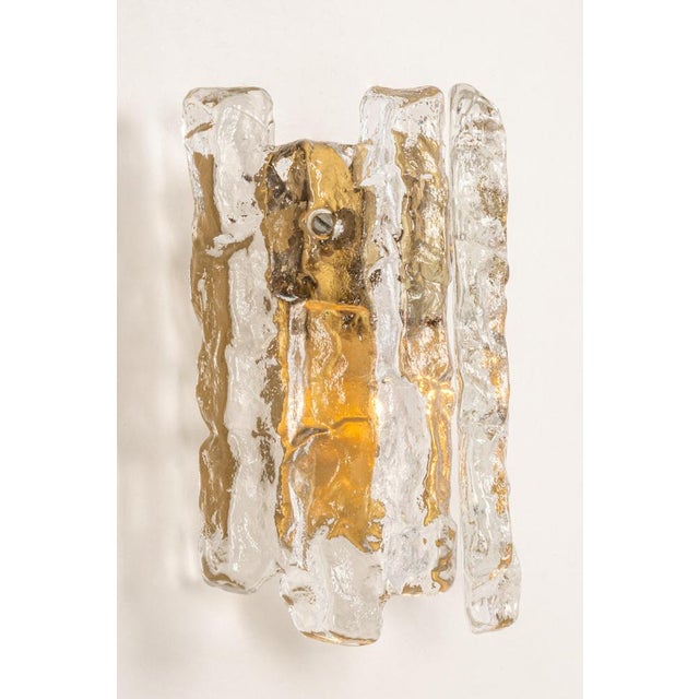 Wonderful pair of mid-century wall sconces with ice glass, made by kalmar, austria and manufactured circa 1960-1969. High...
