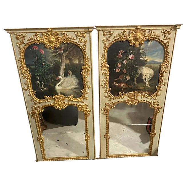 An exquisite pair of trumeau mirrors. Mirrored glass on the bottom halves of each. Top halves include a hand painted...