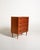 Scandinavian teak chest of drawers from the 1960s, featuring four large drawers and double recessed handles. The frame is...