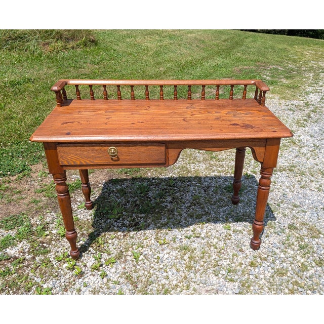 Antique Railroad Depot Desk with Spindle Gallery Cherry and Ash Wood 1900s Antique Railroad depot desk dating back to the...