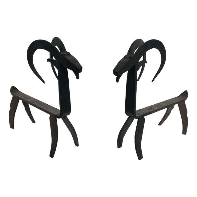 1950s Pair of wrought iron andirons representing a goat in the style of Edouard Schenck For Sale