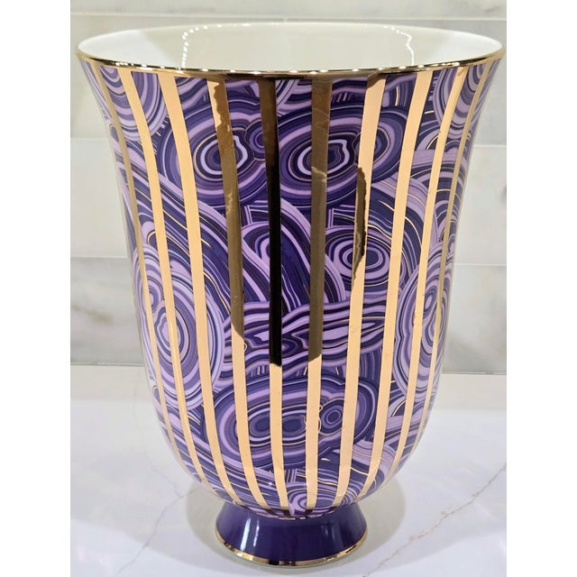 A striking Jonathan Adler Malachite Stripe Urn Vase in purple, with a swirling, malachite-inspired pattern and bold...
