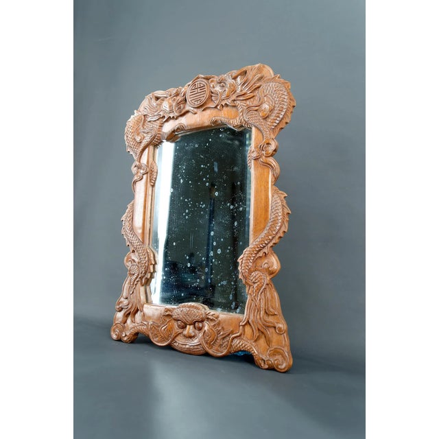 Carved Wooden Dragon Mirror, Indochina, Circa 1900 The frame, executed with exceptional craftsmanship, features a...