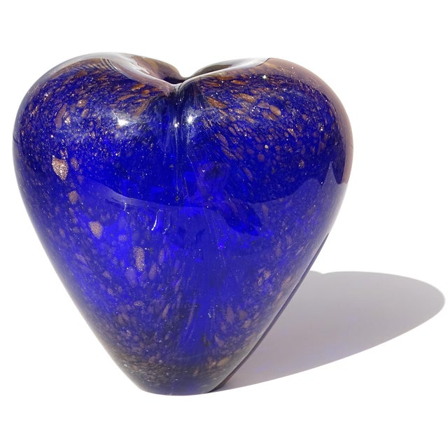 Beautiful hand blown sapphire blue with copper aventurine flecks studio art glass flower vase. It is shaped in the form of...