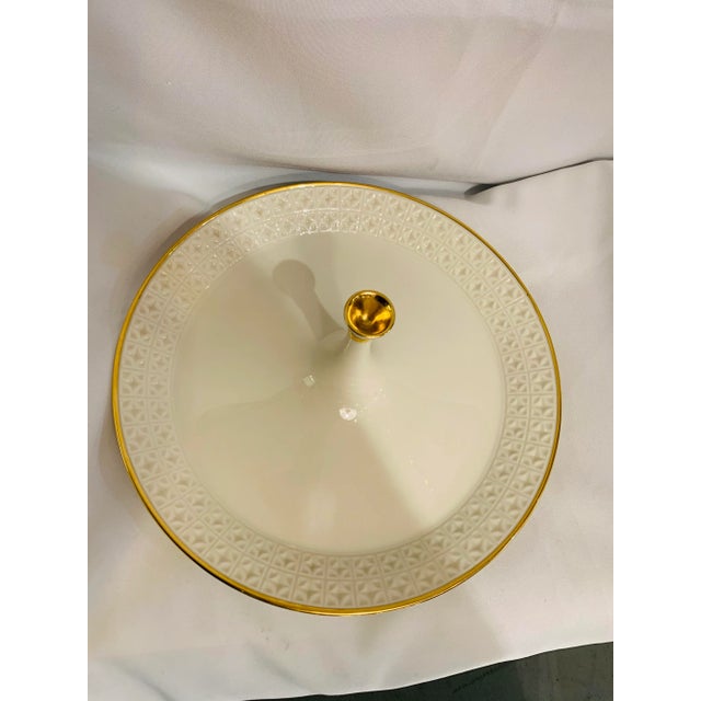 This elegant and modernist-inspired porcelain center handle tray by LENOX, features a sleek shape and a simple pattern...