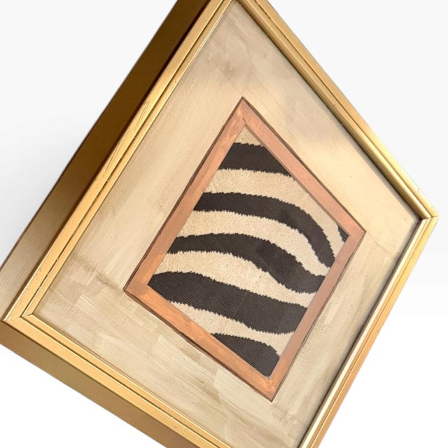 A one-of-a-kind piece of upcycled wall décor featuring Schumacher’s iconic Zèbre Épinglé textile, repurposed as bold...