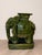 Striking pair of emerald green glazed ceramic elephant plant stands in the Hollywood Regency style. Each elephant features...