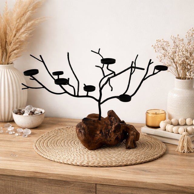 A striking one-of-a-kind sculptural candelabra combining **hand-carved natural root wood** with an expressive **forged...