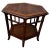 This table is made in the Boho Chic style. It has a cane lower shelf and an octagon top. It's made of walnut and has an...
