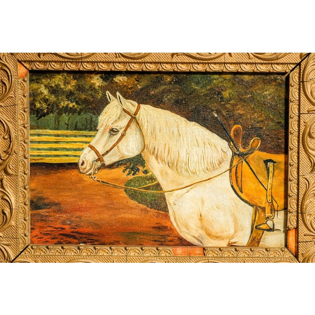 A charming 19th-century equestrian oil painting on board, this wonderfully atmospheric work depicts a handsome white horse...