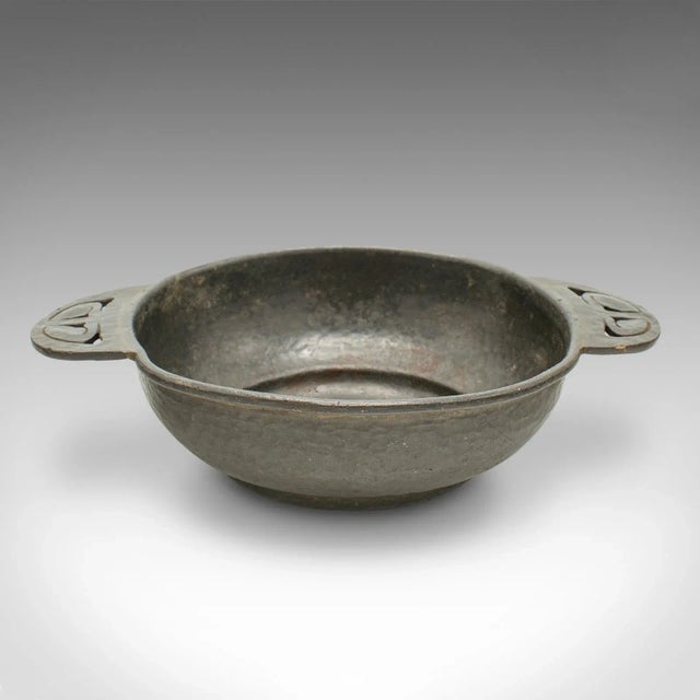 This is a small antique salter. An English, Tudric pewter dish from Liberty of London by Archibald Knox, dating to the...