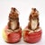 A pair of candle holders from Fitz and Floyd under their OCI Omnibus division. They feature hand-painted brown squirrels...