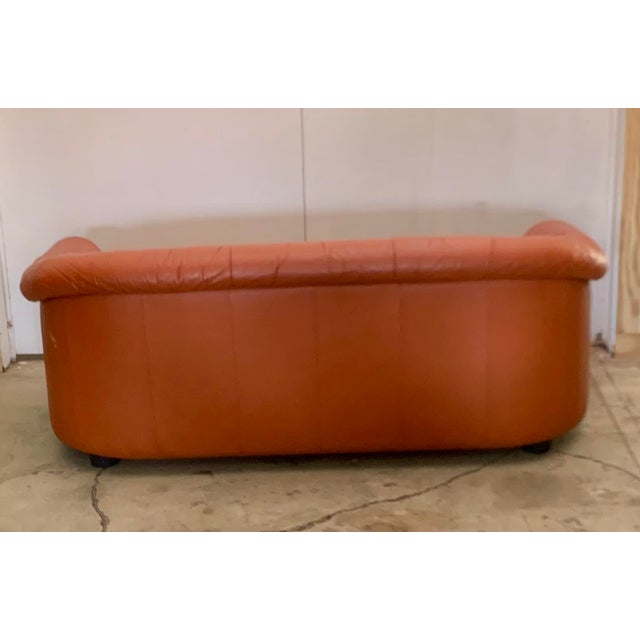 This funky orange leather 3-seater sofa. Is perfect for the place , that loves color . Purchased in Copenhagen this piece...