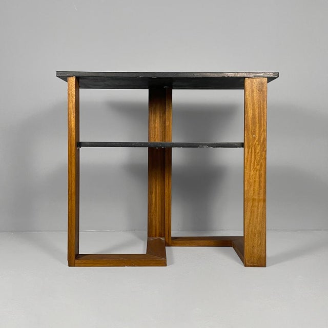 Italian modern rectangular coffee table in wood, 1970s Coffee table or console table made entirely of wood. It features a...