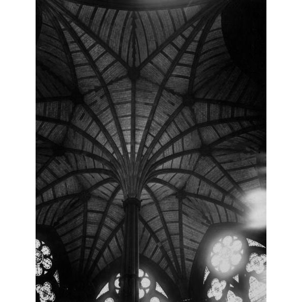 Abbey Ceiling circa 1940: The fine fan vaulting on the ceiling of Westminster Abbey in London, surrounded by stained glass...