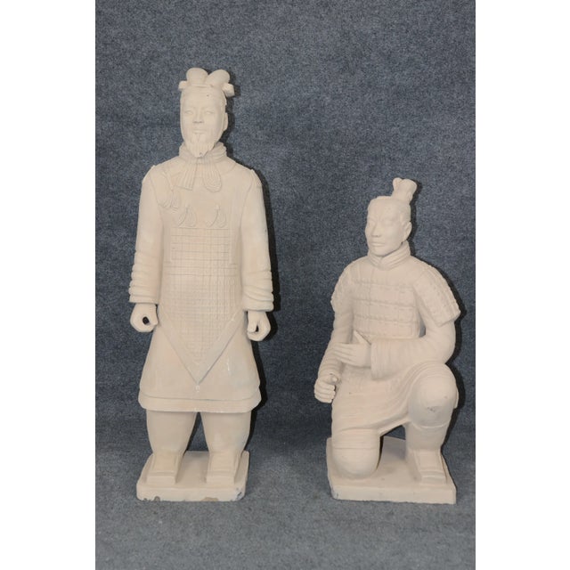 This striking pair of terra cotta Chinese warrior sculptures are faithful replicas of the legendary Qin Shi Huang...