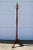Beautiful freestanding mahogany coat rack with brass hooks and a brass pineapple finial attributed to The Bombay Company....