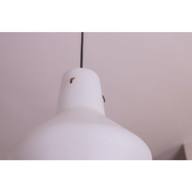 Stilnovo-designed opal glass pendant made in the 1970s. The canopy is made of white opal glass. The pendant is ideal for...