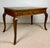 Elegant Spanish writing desk crafted in oak during the 1940s. The desk features a spacious rectangular top above three...