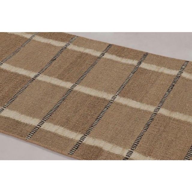 Handwoven in a sustainable blend of hemp, linen, and New Zealand wool, this 3x5 flatweave is a premier selection from the...