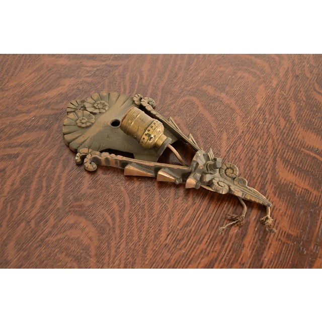 A gorgeous Art Deco period bronze wall sconce In the manner of Tiffany Studios By Mid-West Manufacturing Co. USA, 1930s...