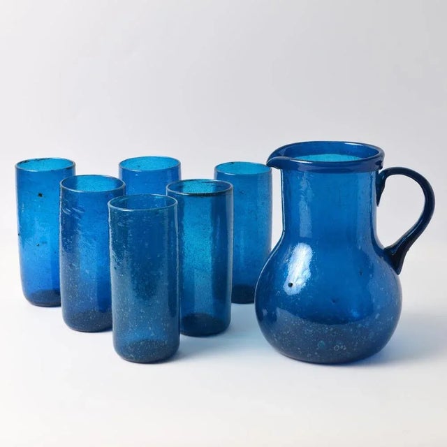 Handmade blue bubble glass (pulegoso) pitcher with tumblers. Made in 1950s/1960s in Italy. Given dimensions are for the...