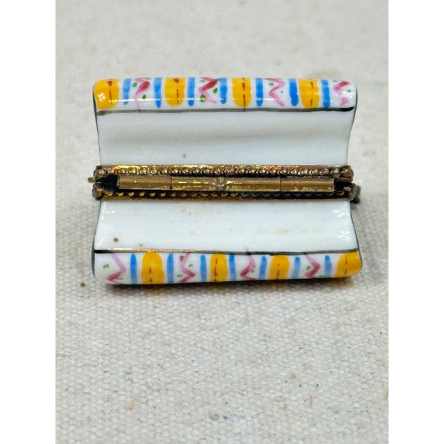 Vintage hand painted box by Limoges in the shape of a purse. This is a pre-owned item so please see all pictures and ask...