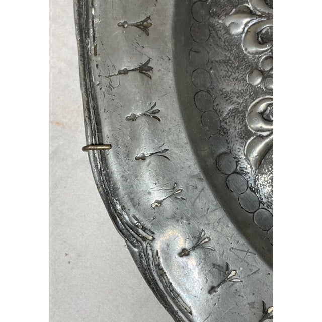 This antique 18th century Latin armorial tooled relief plate is a true masterpiece. Crafted with exquisite attention to...